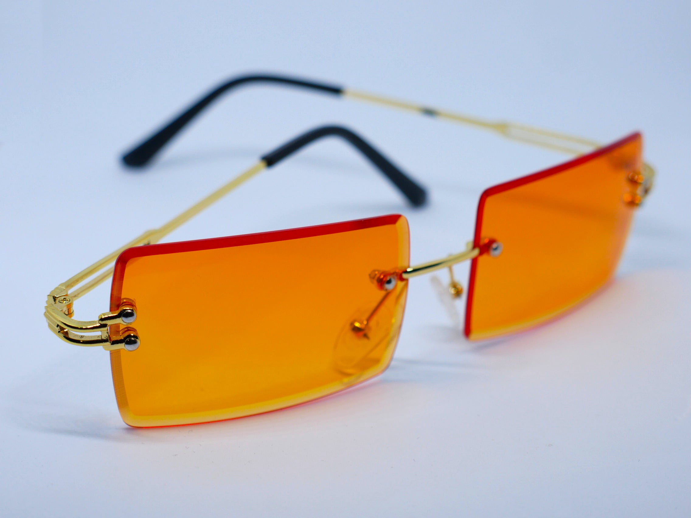 Rimless orange sunglasses on sale